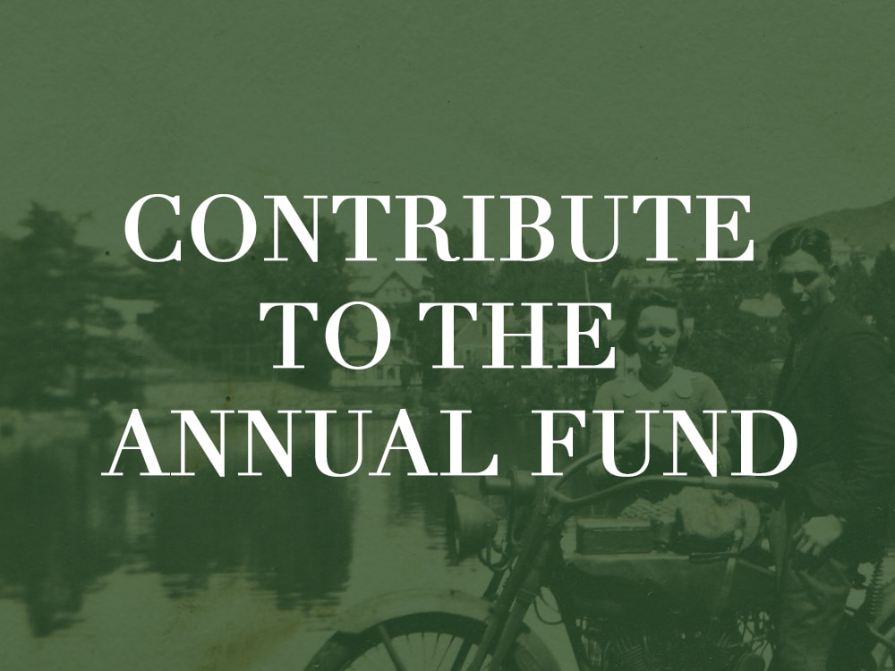 A green-toned photograph of two people with a text overlay reading "Contribute to the annual fund"